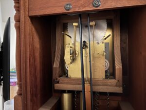 The inside of a Franz Hermle Grandfather clock from 1975.