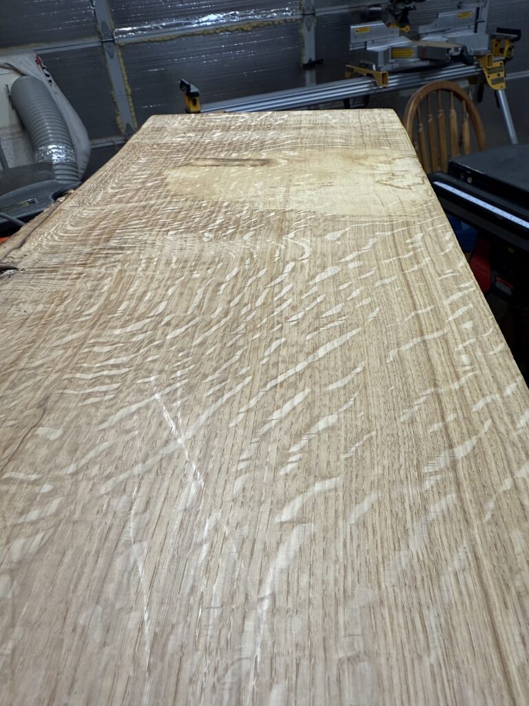 A photograph of a single piece of oak wood, showing some really pretty figuring patterns